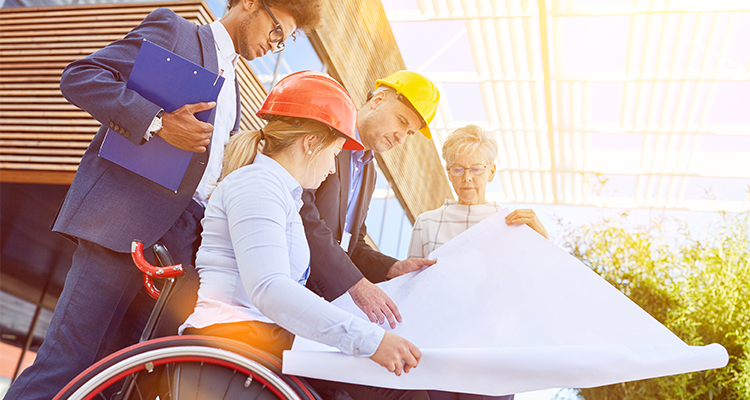 A group of construction workers representing inclusion observing a map