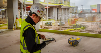 Man in hard hat engaged in site productivity