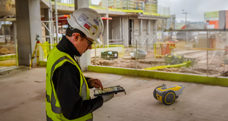 Man in hard hat engaged in site productivity