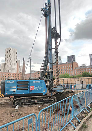 Piling drill in city building site
