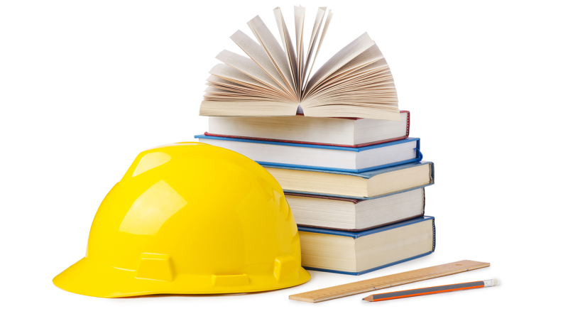 Yellow construction hard hat sat next to a pile of school text books to support Galliford school construction article