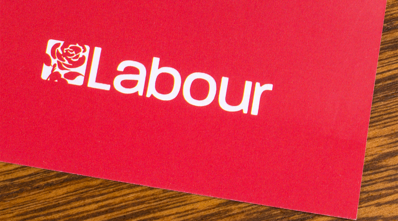 Labour logo laid out on a desk to support Labour's Housing article