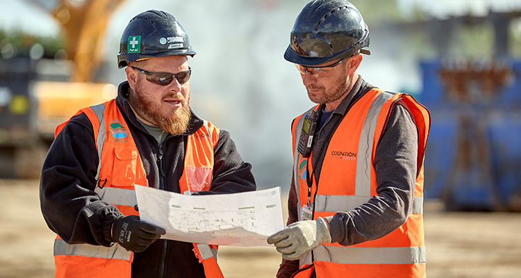 Cognition workers looking at plans