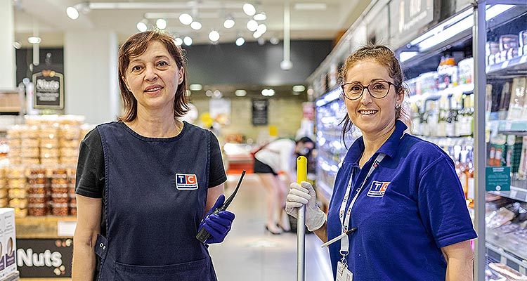 Two TC facilities management workers in a store