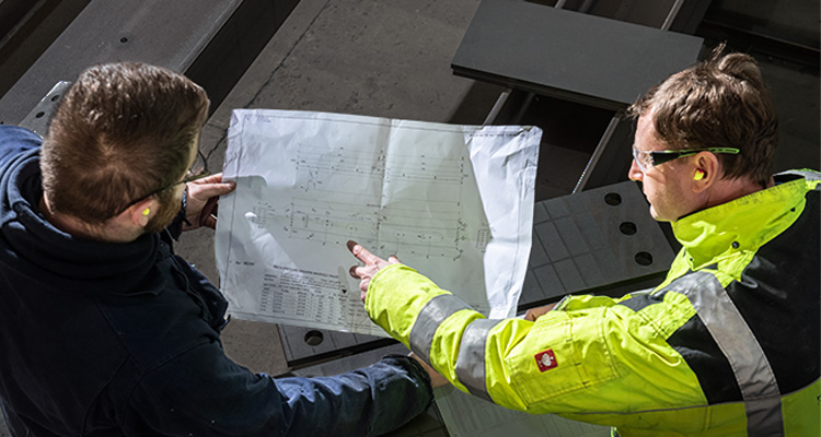 Builders looking at a schematic