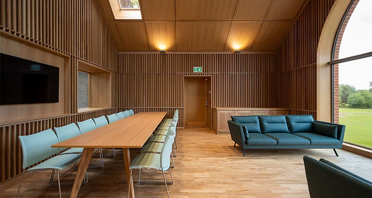 Wood panelled room with large window