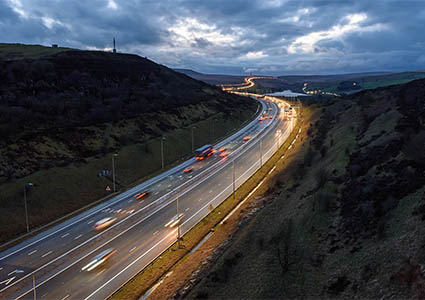 Light trails on M62 at night near Leeds, West Yorkshire, UK.