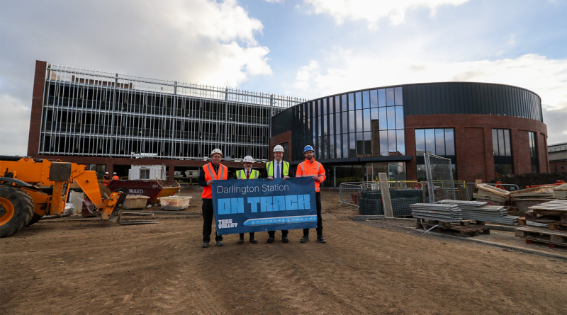 Darlington Station redevelopment team stood outside with sign