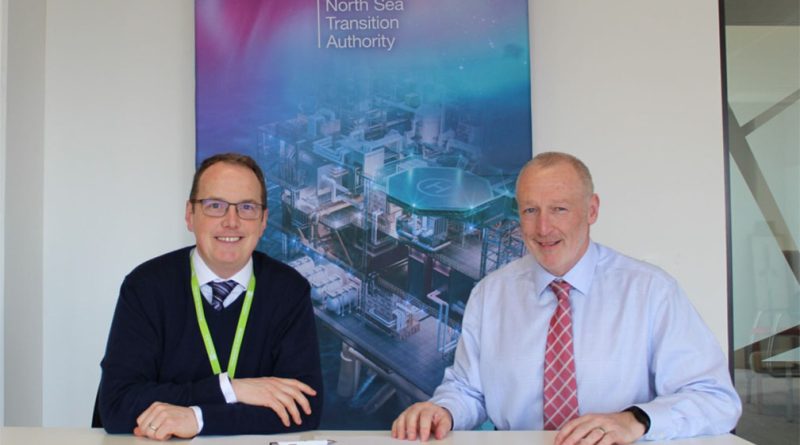 Stuart Payne, Chief Executive of the NSTA, and Alistair Macfarlane, NSTA Head of Carbon Storage and Transportation, signing documents for HyNet for Liverpool Bay CCS project