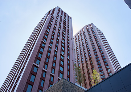 two modern, high-rise residential buildings