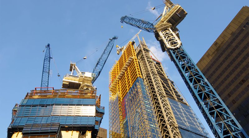 UK construction site with scaffolding and cranes