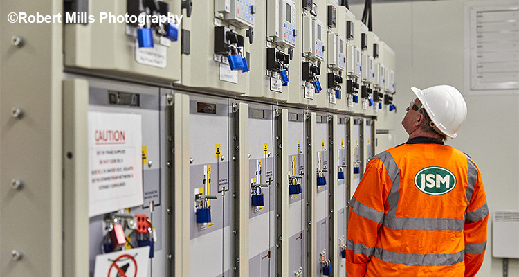 an engineer from JSM Group inspecting electrical equipment