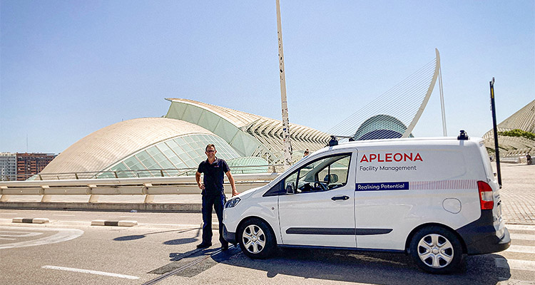 Integrated, innovative and impressive to the core, Apleona UK represents the finest in facility management a man standing next to a white van with the Apleona logo and text.