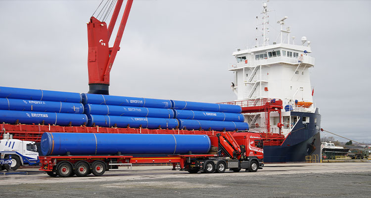 FT Pipeline Systems drives innovation in water pipelines as it helps deliver major infrastructure projects large steel pipes being offloaded at a port from a cargo vessel