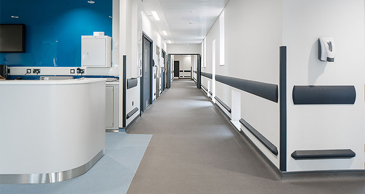 a modern hospital corridor equipped with a wall protection system