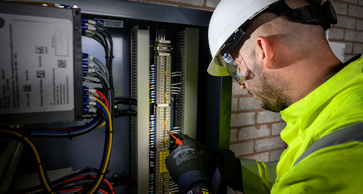Part of Matrix Group, Matrix Networks’ end-to-end utility solutions bring complex infrastructure projects to life an electrician or technician working on an electrical panel.