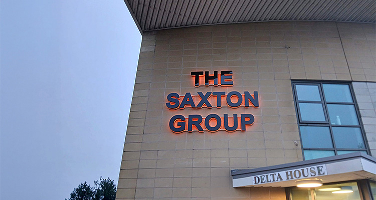 the entrance to "The Saxton Group" located at "Delta House".