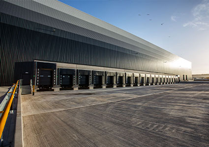 a modern industrial logistics warehouse or distribution center. 
