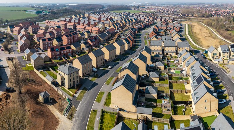 Road construction project supporting new housing development near a major UK motorway