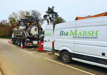 a  BioMarsh Environmental liquid waste disposal truck and van branded in white with green and blue lettering