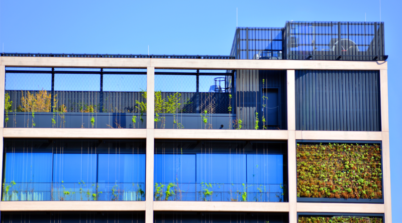 Sustainable glass office building with trees for reducing carbon dioxide