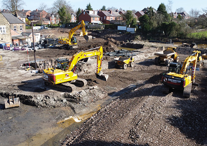 an active construction site undergoing major earthmoving and ground preparation works.