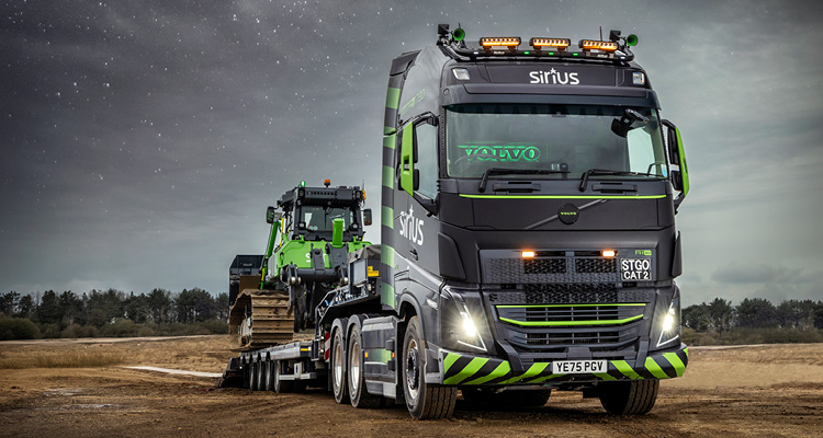 a Volvo FH16 780 Globetrotter XL 6x4 tractor unit owned by The Sirius Group, featuring custom black and green livery and Alcoa Dura-Bright wheels