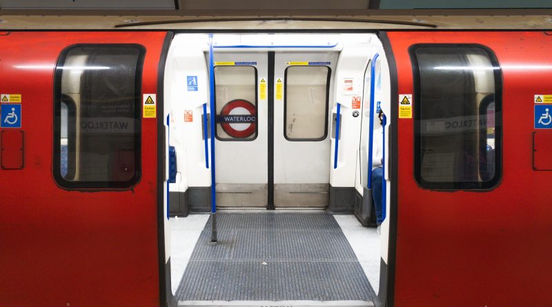 London Underground train at Waterloo station with open doors, level boarding access and wheelchair accessibility signage as accessible transport provides £100bn opportunity for UK.