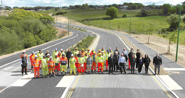 the team from Cormac Ltd standing together to mark the formal opening of Fordh Langarth