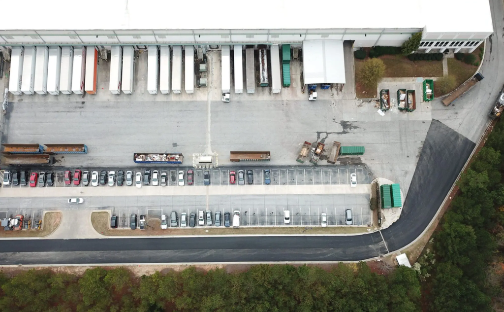 Loading dock area showing fiber-reinforced pavement placed during overnight shifts in below-45°F temperatures without mixing complications.
